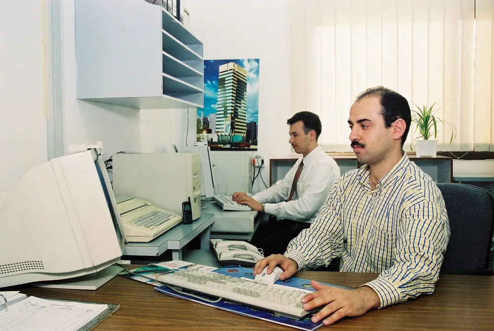 ALSUWEIDI engineers at their computers in the early office