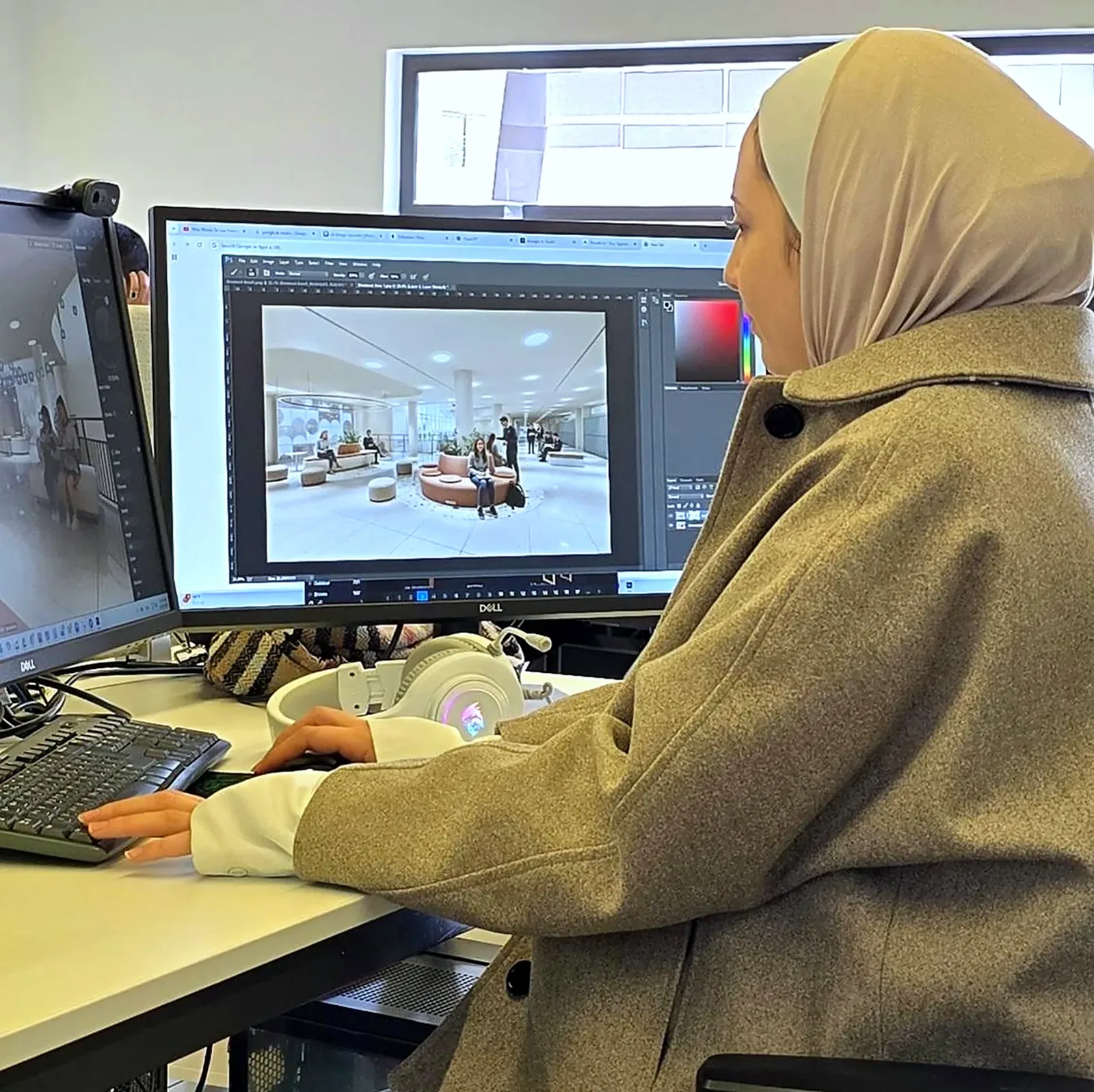 A designer working on a visualisation at ALSUWEIDI
