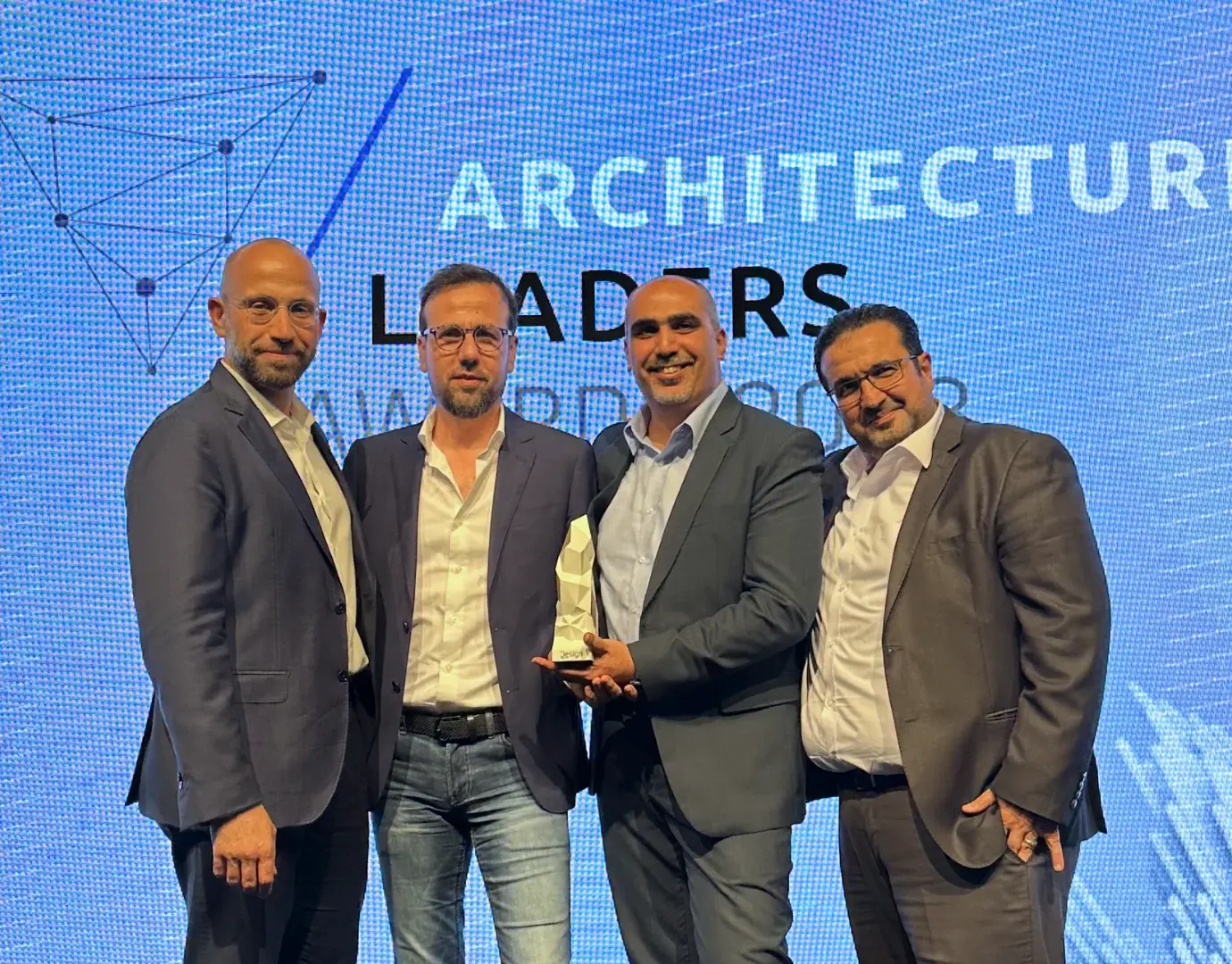 The ALSUWEIDI team receiving an Architecture Leaders award