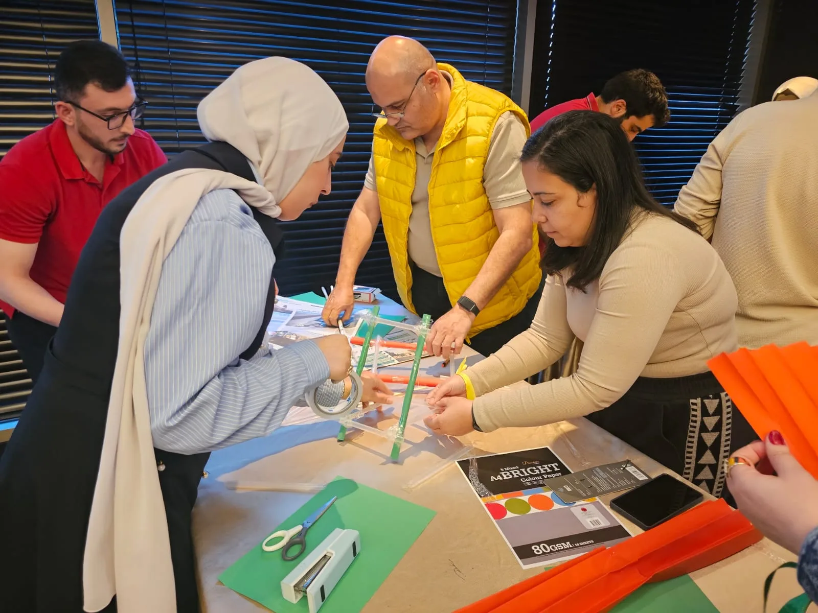 ALSUWEIDI colleagues working together on a model